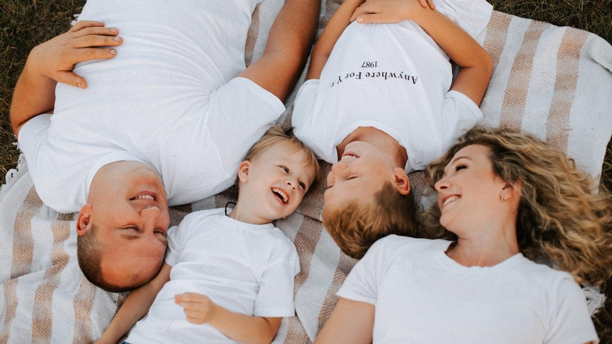 a group of people laying on top of each other